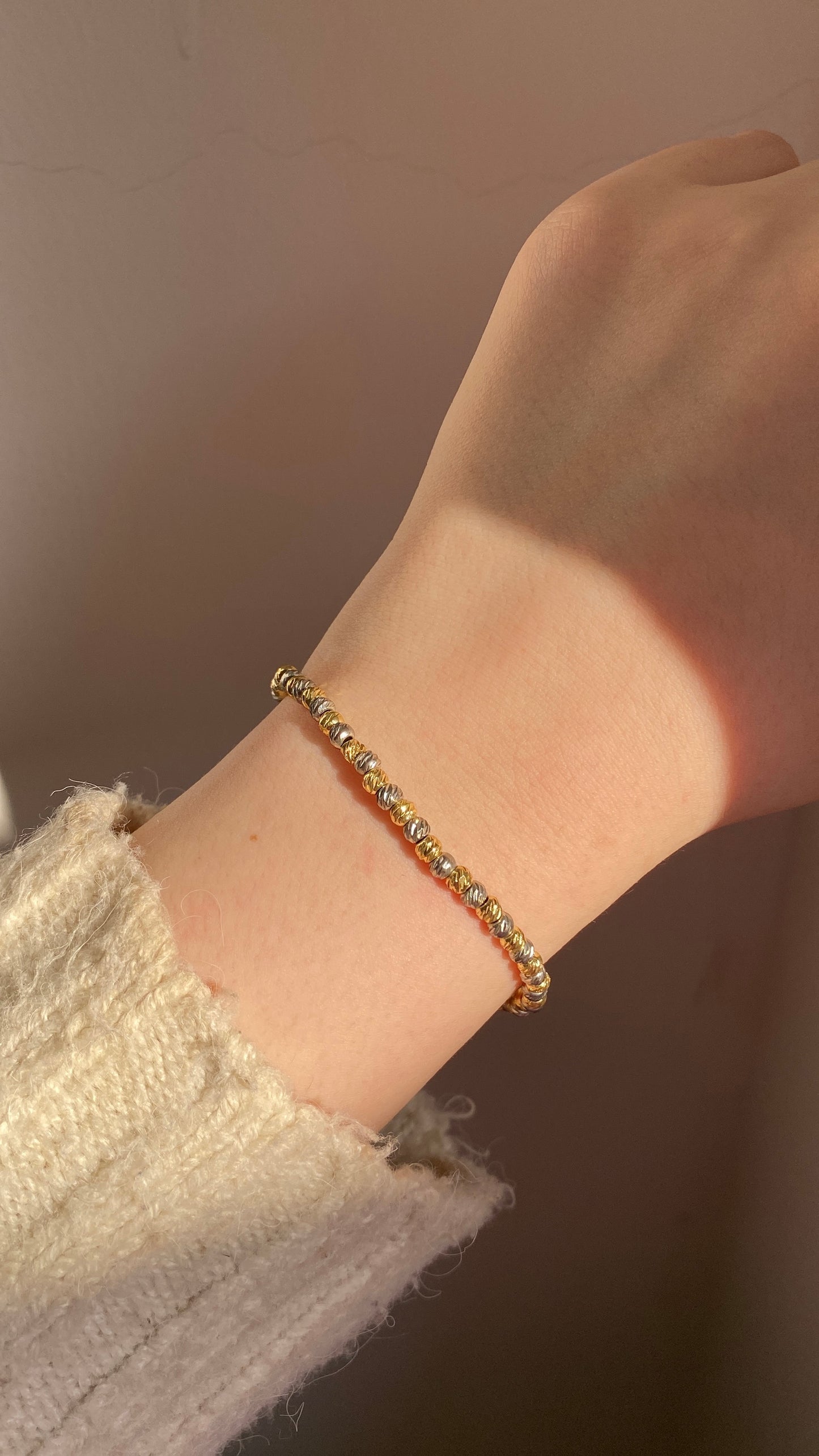 Silver and gold beaded bracelet