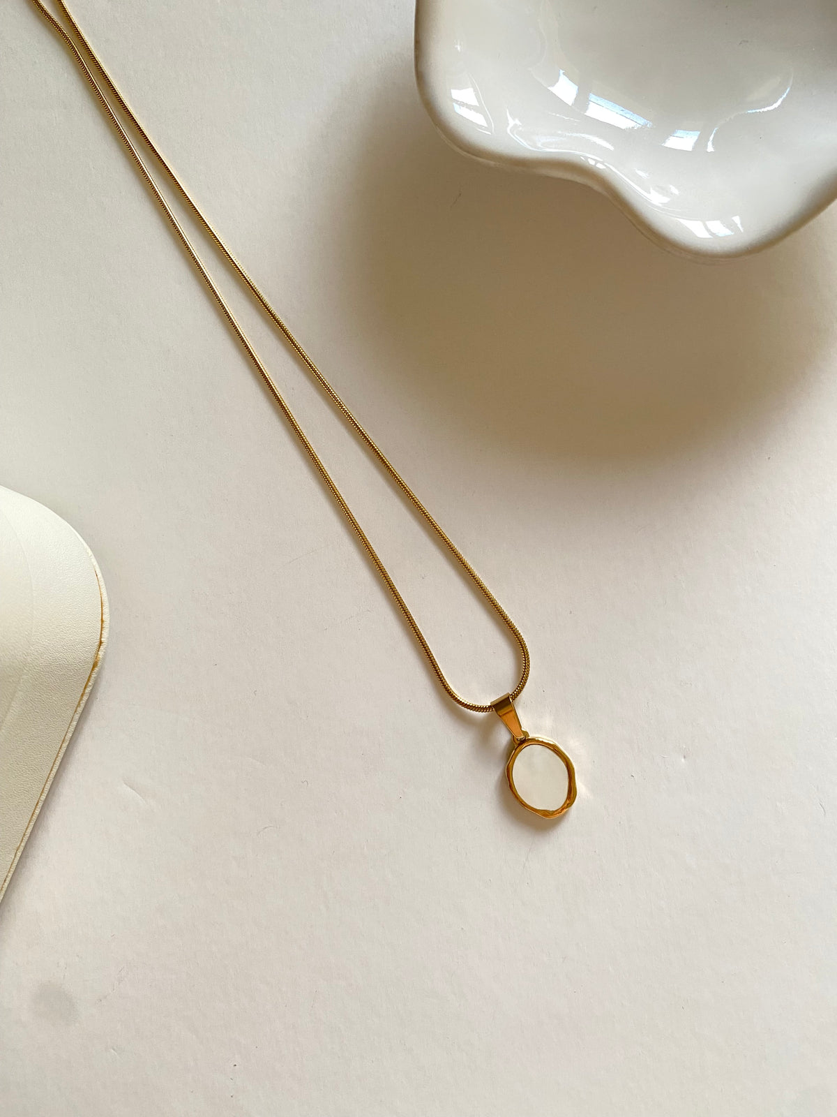 Oval white enamel necklace