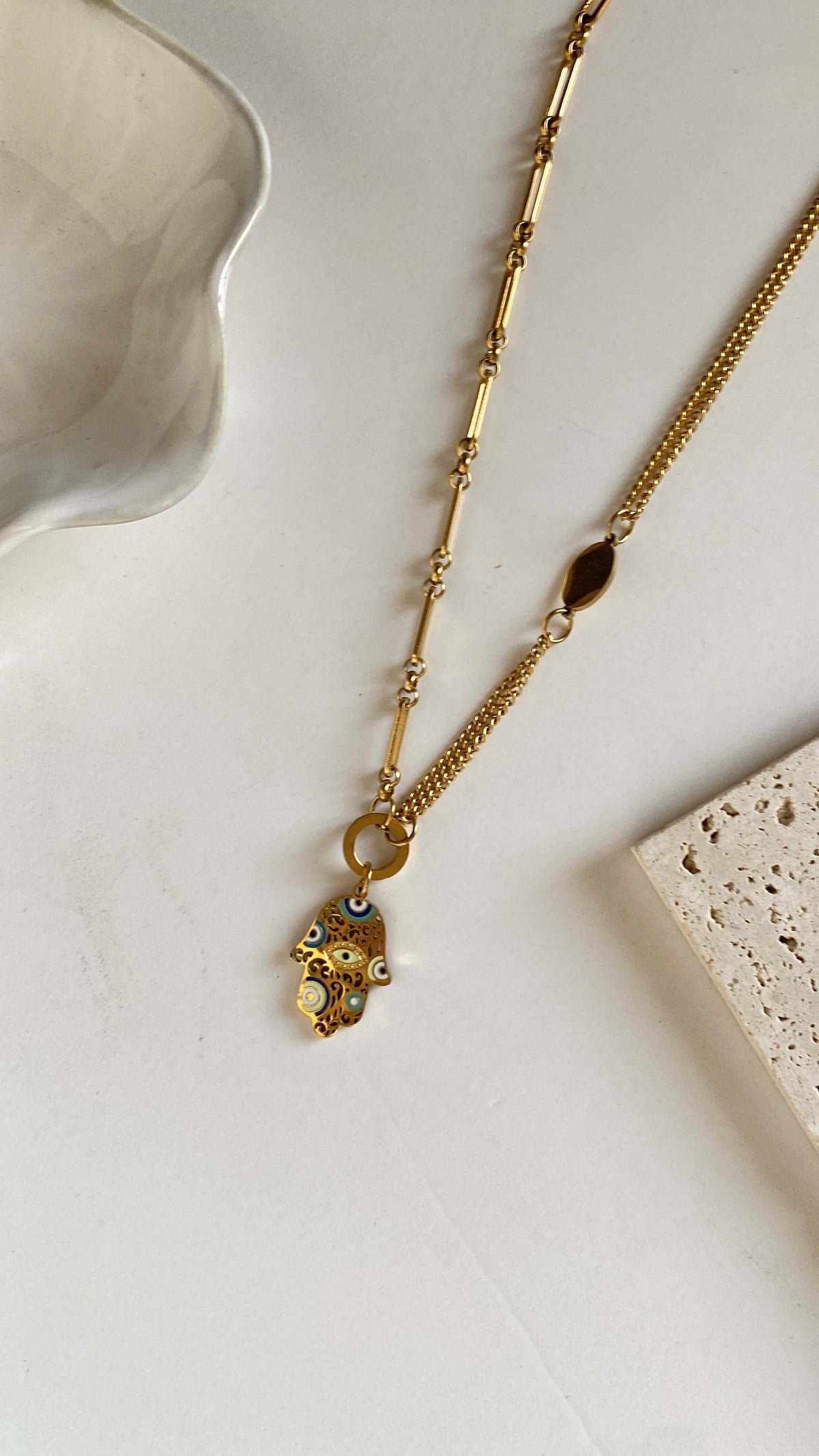 Blue hand necklace