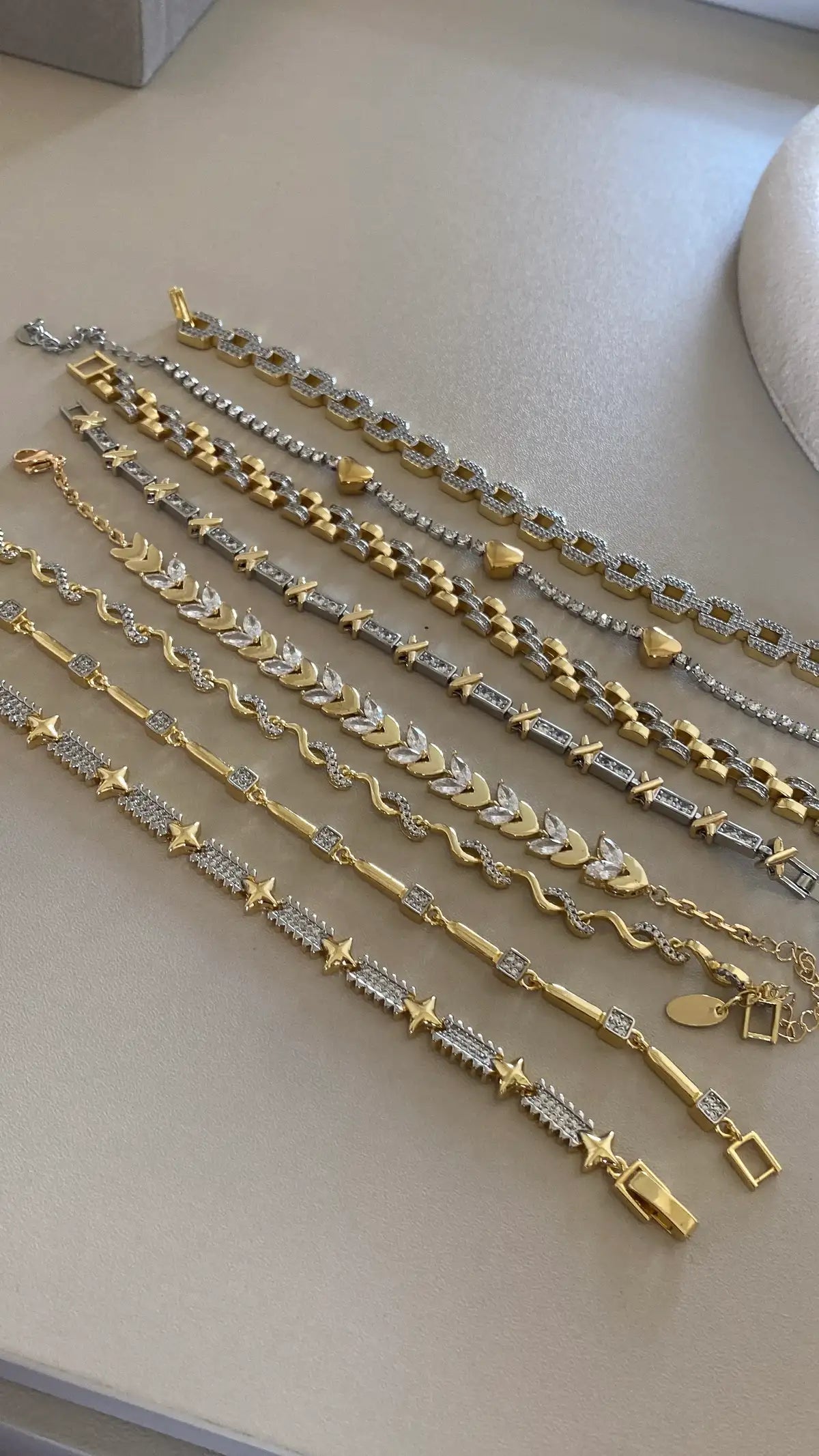 Silver in gold bracelets